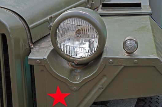Headlights of an retro military vehicle during World War II.