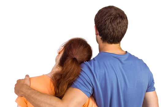 Couple with backs to camera on white background