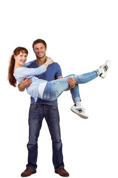 Man lifting up his girlfriend on white background