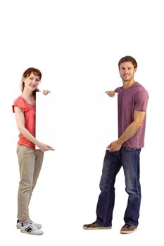 Couple holding a white sign on white background