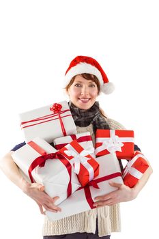 Woman holding lots of presents on white background