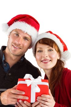Couple holding a christmas gift on white background