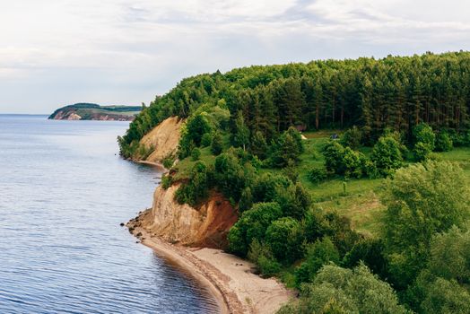 Camp on river bank in pine wood