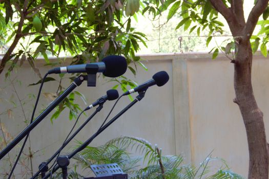 Microphones ready to use on stands.