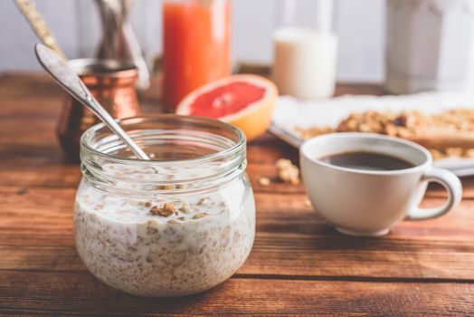 Healthy breakfast with homemade granola, turkish coffee, fruits and freshly squeezed juice