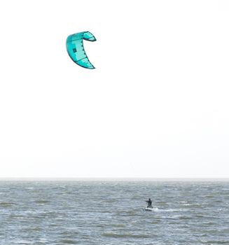 Kitesurfing on the waves of a dutch lake