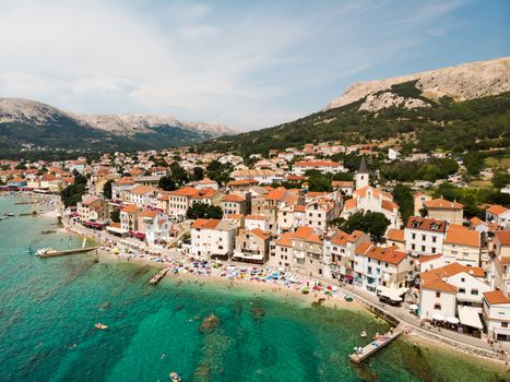 Aerial panoramic view of Baska town, popular touristic destination on island Krk, Croatia, Europe.