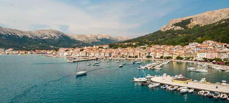 Aerial panoramic view of Baska town, popular touristic destination on island Krk, Croatia, Europe.