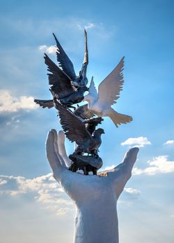 Kusadasi, Turkey – 07.18.2019.  Hand of Peace sculpture on the Kusadasi promenade in Turkey