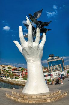 Kusadasi, Turkey – 07.18.2019.  Hand of Peace sculpture on the Kusadasi promenade in Turkey