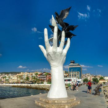Kusadasi, Turkey – 07.18.2019.  Hand of Peace sculpture on the Kusadasi promenade in Turkey