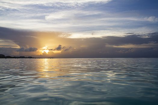 Beginning of sunset view from the surface of the water