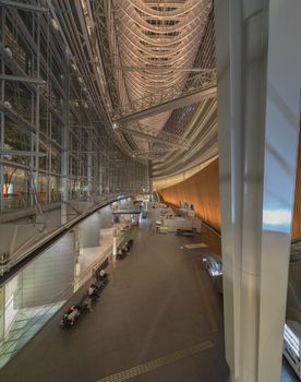 Inside view of Tokyo International Forum built in 1996 by Uruguayan architect Rafael Viñoly near Yurakucho station. It consists of 14 floors including 3 in the basement and consists of four buildings and a glass atrium. Its boat-like structure reveals its steel beams that contrast with its glass walls. Every year there are organized different events of classical music like "La folle Journée au Japon".