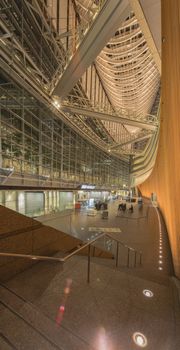 Inside view of Tokyo International Forum built in 1996 by Uruguayan architect Rafael Viñoly near Yurakucho station. It consists of 14 floors including 3 in the basement and consists of four buildings and a glass atrium. Its boat-like structure reveals its steel beams that contrast with its glass walls. Every year there are organized different events of classical music like "La folle Journée au Japon".