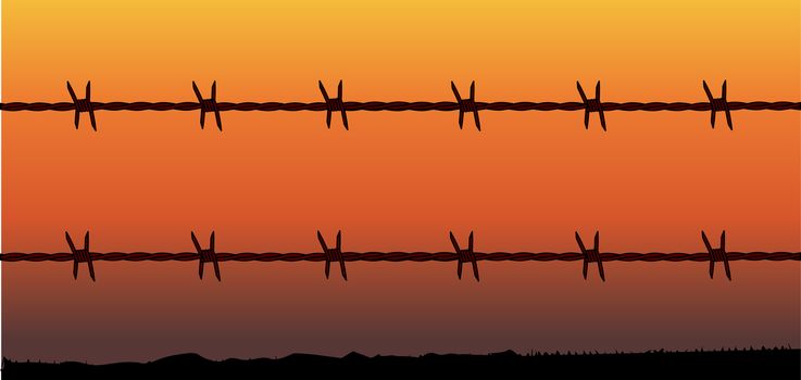 A barbed wire fence with a barren desert sunset