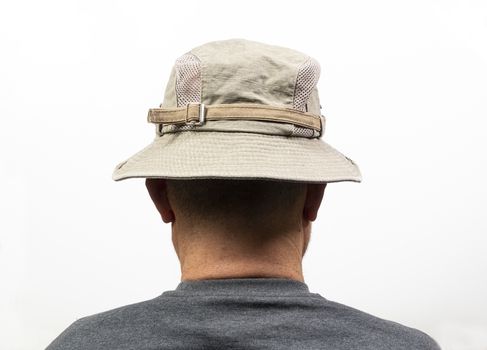A middle-aged man turned from the back with his Hat