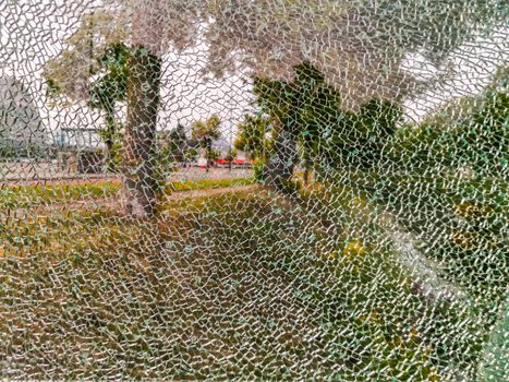 glass window completely cracked, scenery shining through, Shattered fragments, Abstract background
