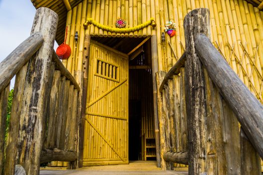 Traditional asian wooden house, entry with doorway, classical home made out of bamboo, Architecture from Asia