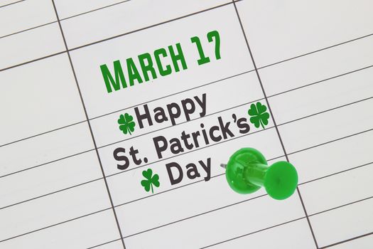 A close up of a calendar on March 17 with the text: Happy St. Patrick's Day