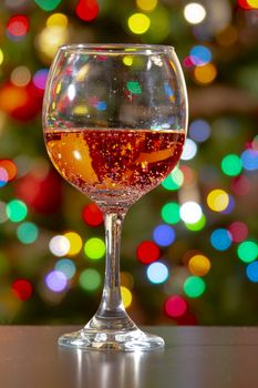 Sweet Fruity Sparkling Rose Wine with bubbles on a wine cup with colourful lights