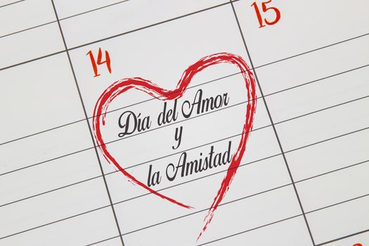 A close up to a Calendar on Feb 14 with the text on Spanish: "Día del Amor y la Amistad" in English means Day Of Love And Friendship