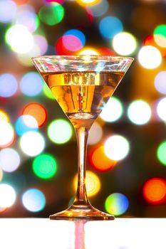 Full Martini Glass with defocused colourfull lights
