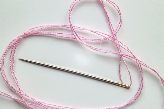 Needle with a Pink Treat on a white background