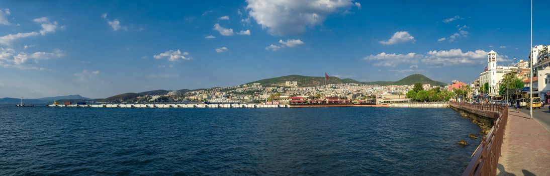 Kusadasi, Turkey – 07.18.2019.  Kusadasi castle in Turkey and pleasure boat parking on a summer evening