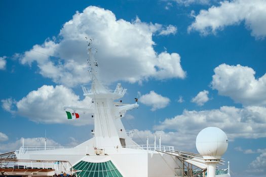 White communication equipment on a luxury cruise ship flying a Mexican flag