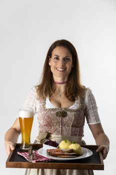 woman in a bavarian dirndl with a tray