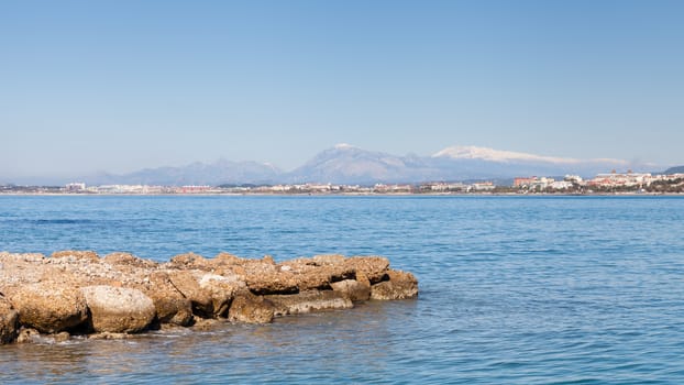 The view towards the west beach of Side taken from the peninsula of the ancient Greek city of Side in southern Turkey.