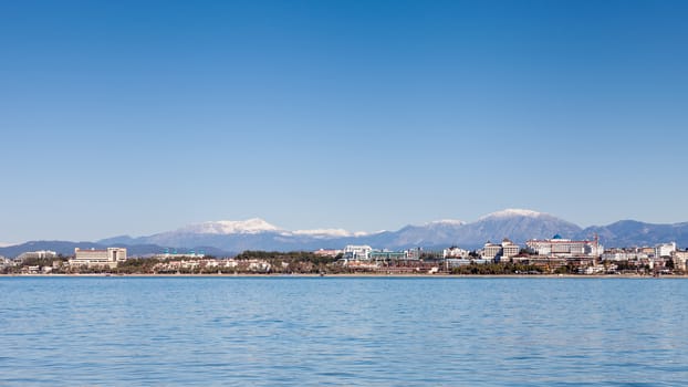 The view towards the west beach of Side taken from the peninsula of the ancient Greek city of Side in southern Turkey.