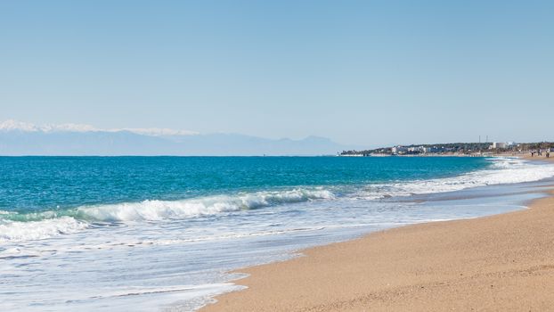 The view looking along Kleopatra Beach in southern Turkey.  The beach is close to the point where Manavgat River enters the Mediterranean Sea.