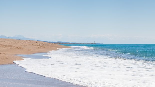 The view looking along Kleopatra Beach in southern Turkey.  The beach is close to the point where Manavgat River enters the Mediterranean Sea.