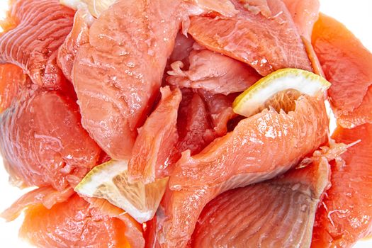 Pieces of red fish on an isolated studio background