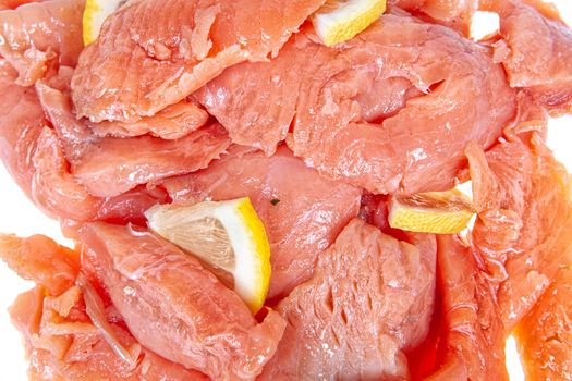 Pieces of red fish on an isolated studio background