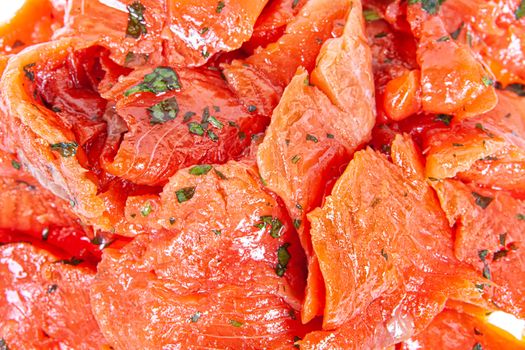 Pieces of red fish on an isolated studio background