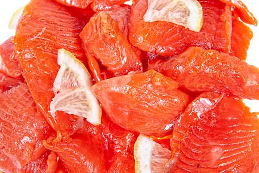 Pieces of red fish on an isolated studio background