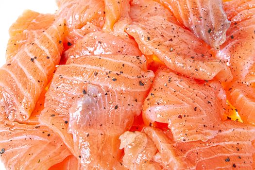 Pieces of red fish on an isolated studio background