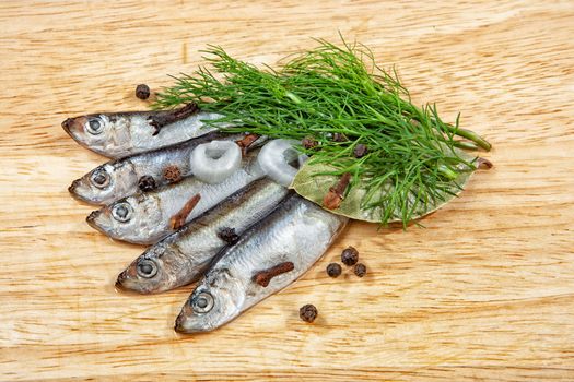 Pieces of herring ona wooden background