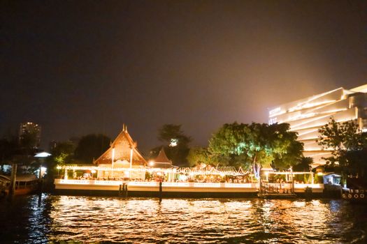 embankment at Chao Phraya River in Bangkok city. cityscape in the evening. Nigt life in asia