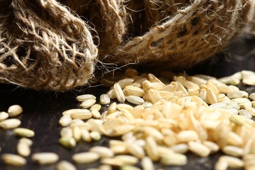 rice corn with on wooden table with cotton bag showing