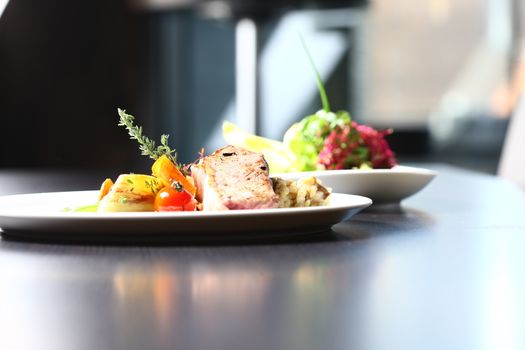 a good meal with meat and salad on white plates