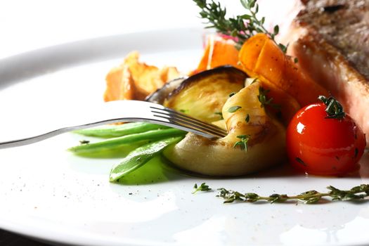 good food - tasty food. Close up of vegetables on a white plate