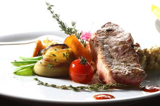 Close up of a piece of meat. a good meal with vegetables on a white plate