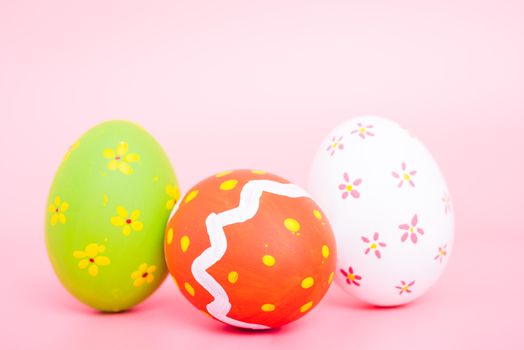 Beautiful Easter group egg multi color on pink background, Easter day concept