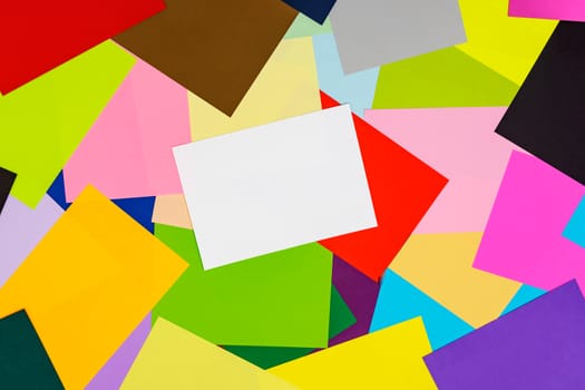 A multi-colored kaleidoscope of colored sheets of paper scattered chaotically in a controlled, beautiful chaos style for a colorful background.