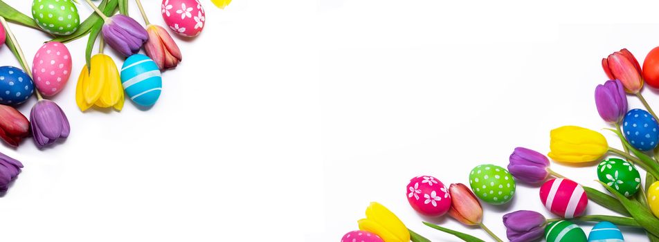Hand-painted easter eggs with tulips isolated on white background frame with copy space for text