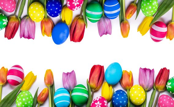 Hand-painted easter eggs with tulips isolated on white background frame with copy space for text