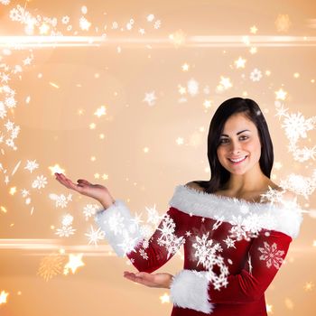 Pretty girl presenting in santa outfit against bright star pattern on cream